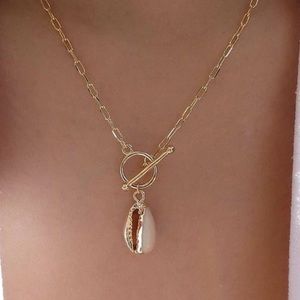 Gold chain cowrie shell necklace